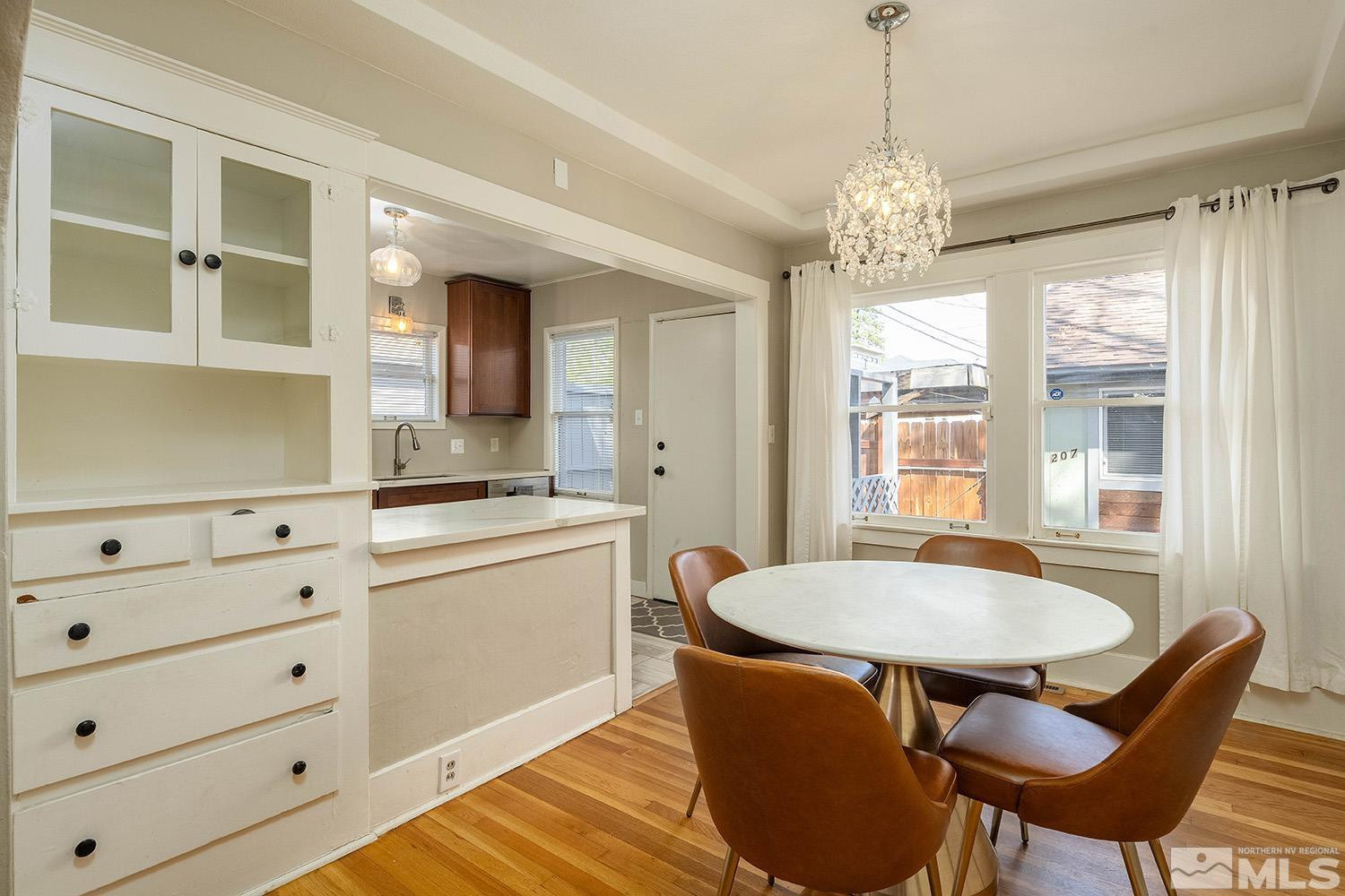207 Martin Street Reno, NV 89509 - Photo 7 of 40 a view of a dining room with furniture window and wooden floor