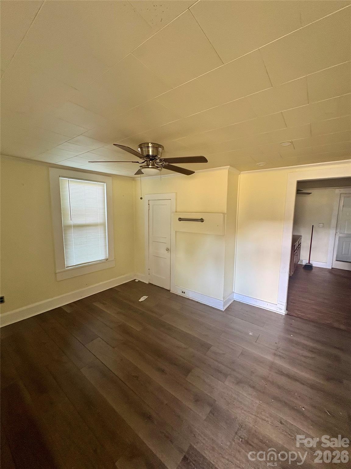 1105 John Miller Road Rockwell, NC 28138 - Photo 4 of 19 an empty room with wooden floor and windows