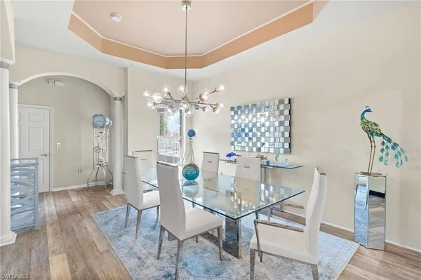 a view of a dining room with furniture and wooden floor