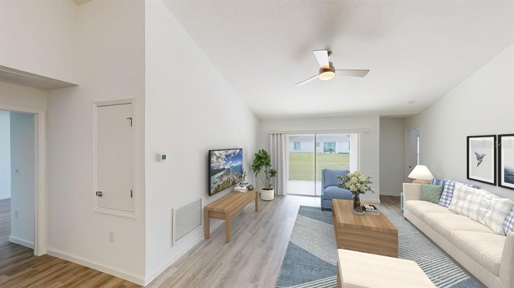 6089 Deer Run Road North Port, FL 34291 - Photo 5 of 10 a living room with furniture and a fireplace