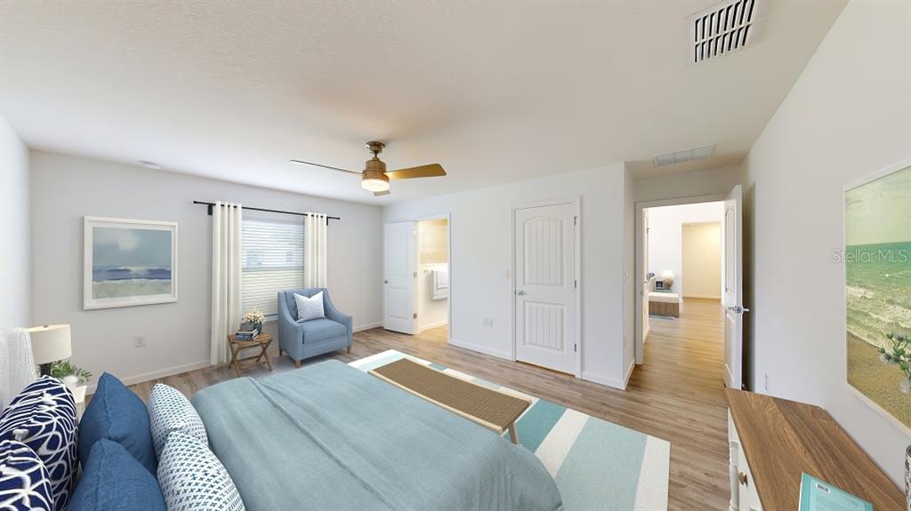 6089 Deer Run Road North Port, FL 34291 - Photo 8 of 10 a bedroom with a bed and wooden floor