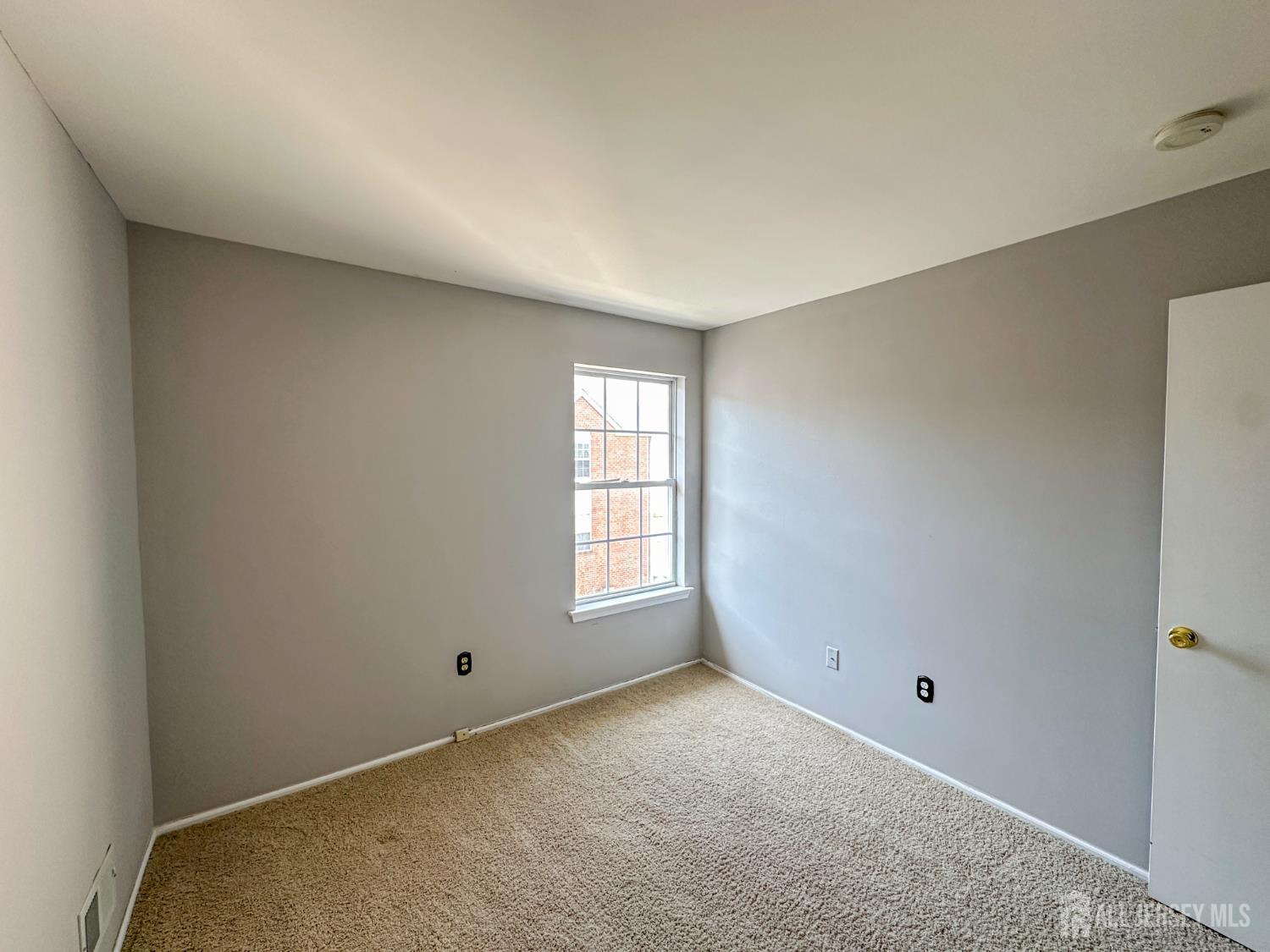 1212 Plymouth Road North Brunswick, NJ 08902 - Photo 18 of 27 a view of an empty room with a window