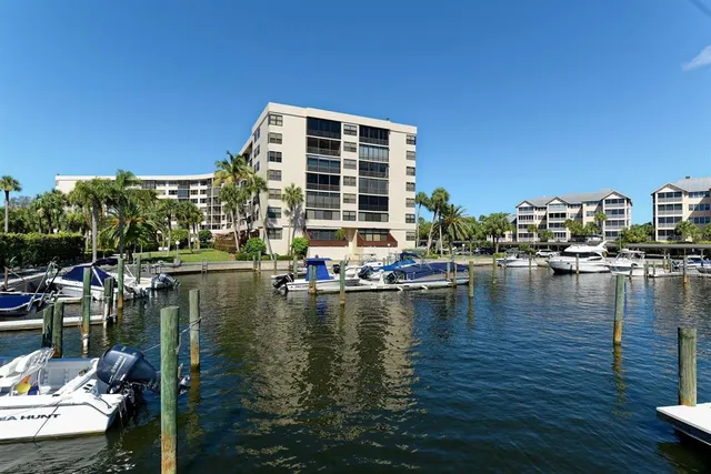a view of a lake with couches in the backyard