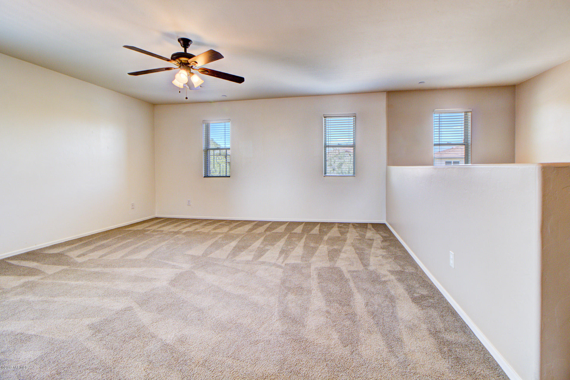 3588 East Mecate Road Tucson, AZ 85739 - Photo 17 of 36 a view of an empty room with a window