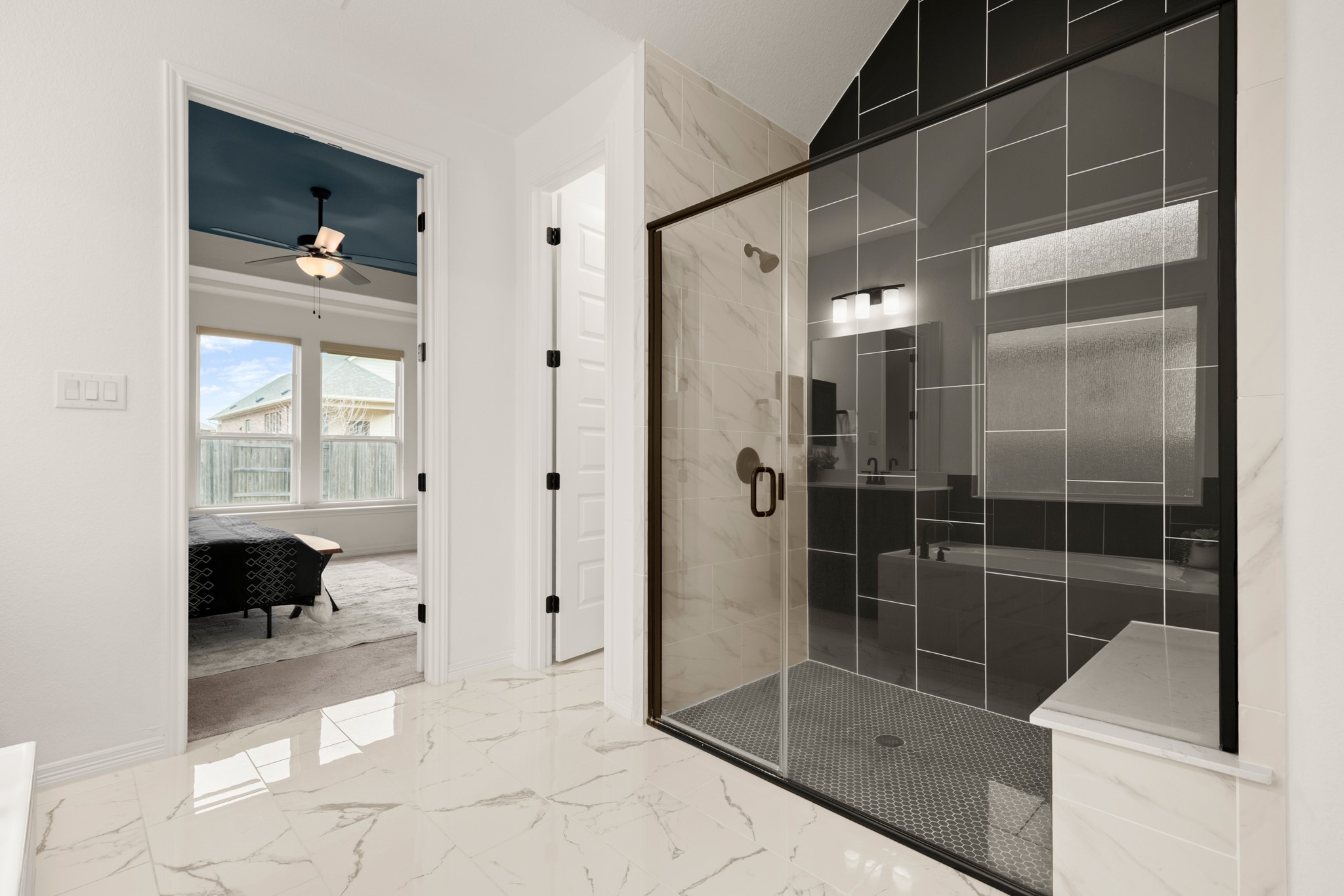 20521 Martin Lane Pflugerville, TX 78660 - Photo 10 of 40 Also enjoy a large frameless glass walk-in shower with designer tile surround and bench seating.