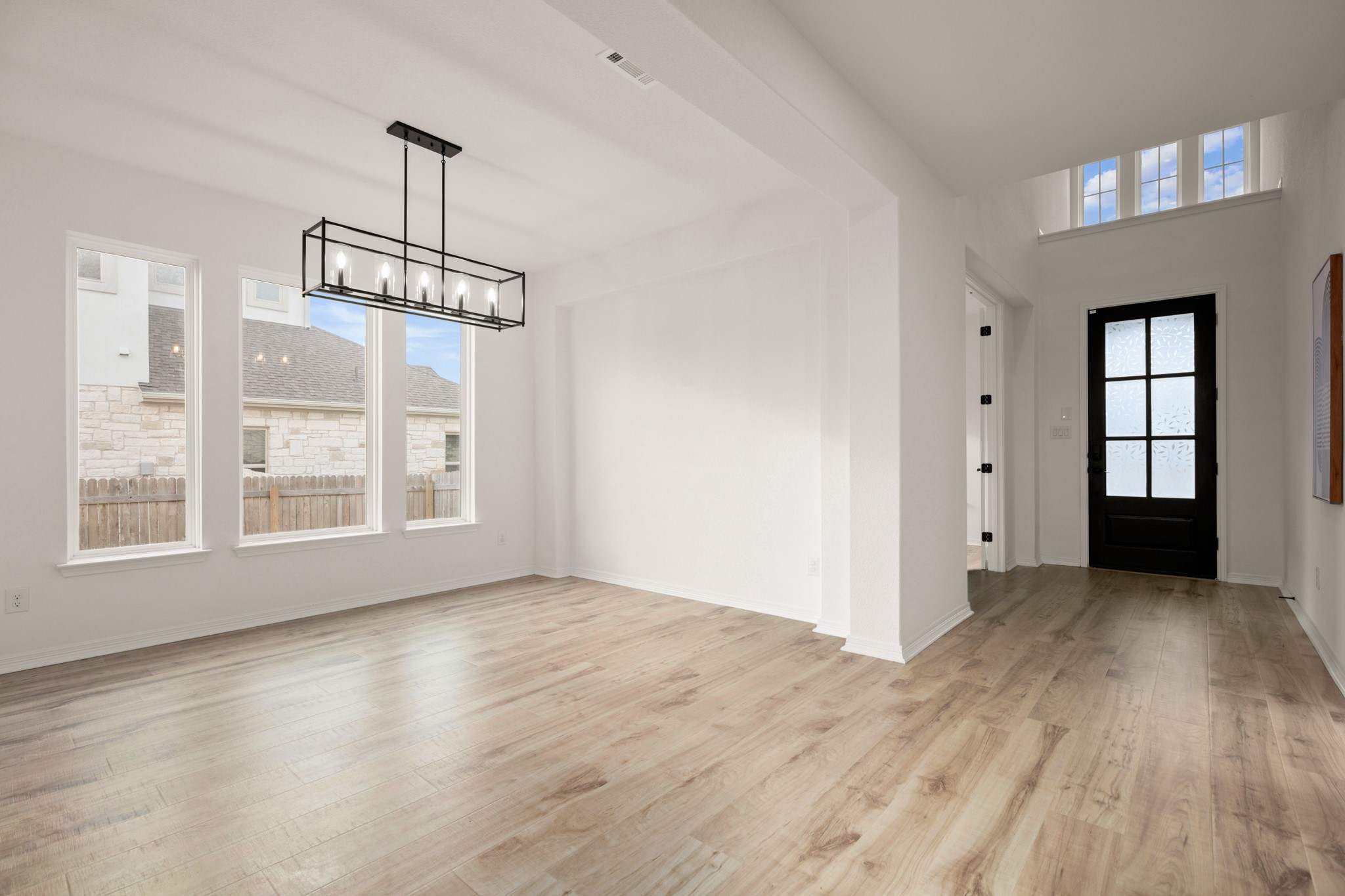 20521 Martin Lane Pflugerville, TX 78660 - Photo 12 of 40 Elegant formal dining stretches off the entry foyer and offers excellent flexibility for use of space.