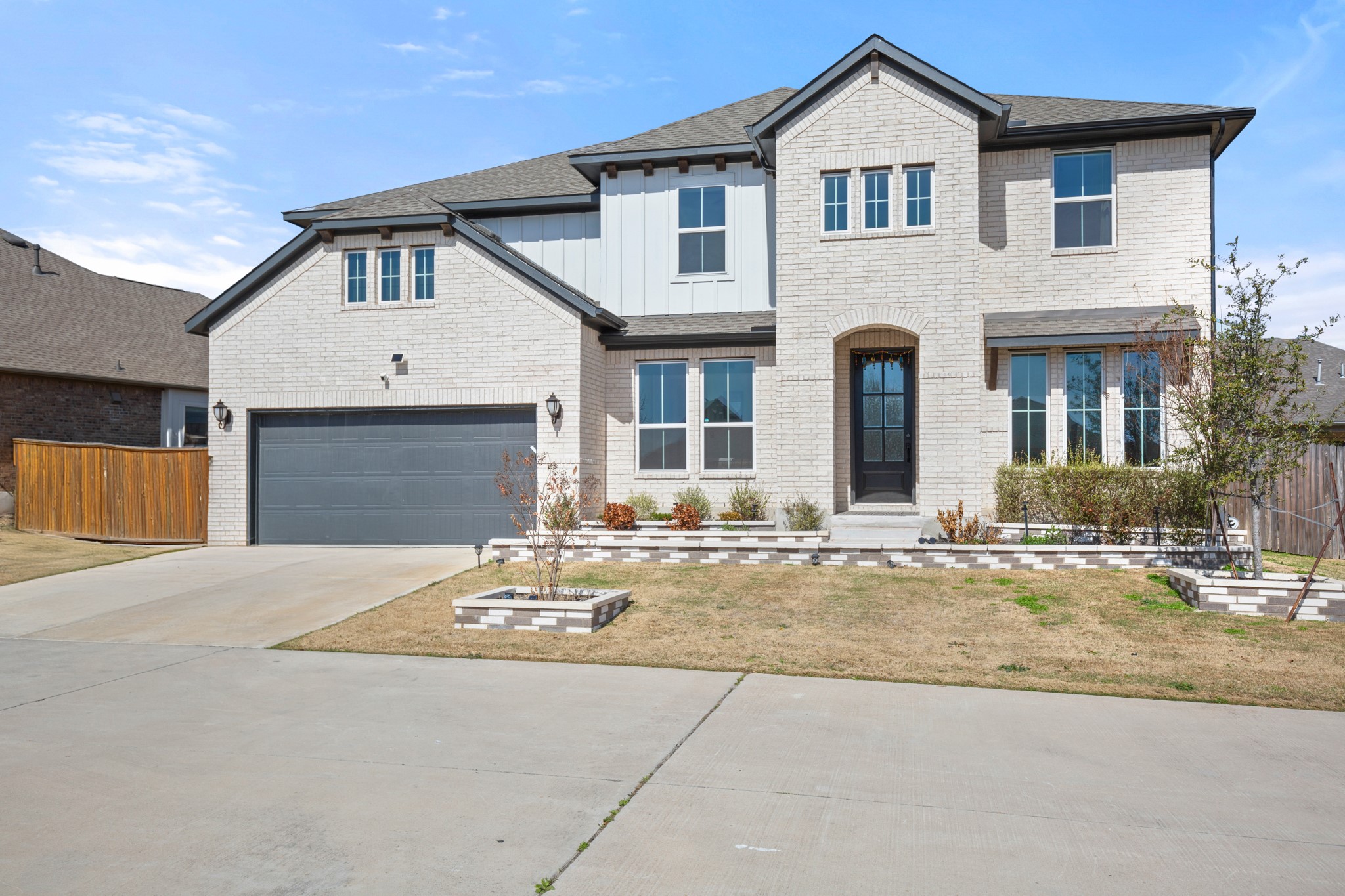 20521 Martin Lane Pflugerville, TX 78660 - Photo 13 of 40 A private drive shared by homes on the street offers extra parking and a tucked-away area where neighbors gather and kids play.