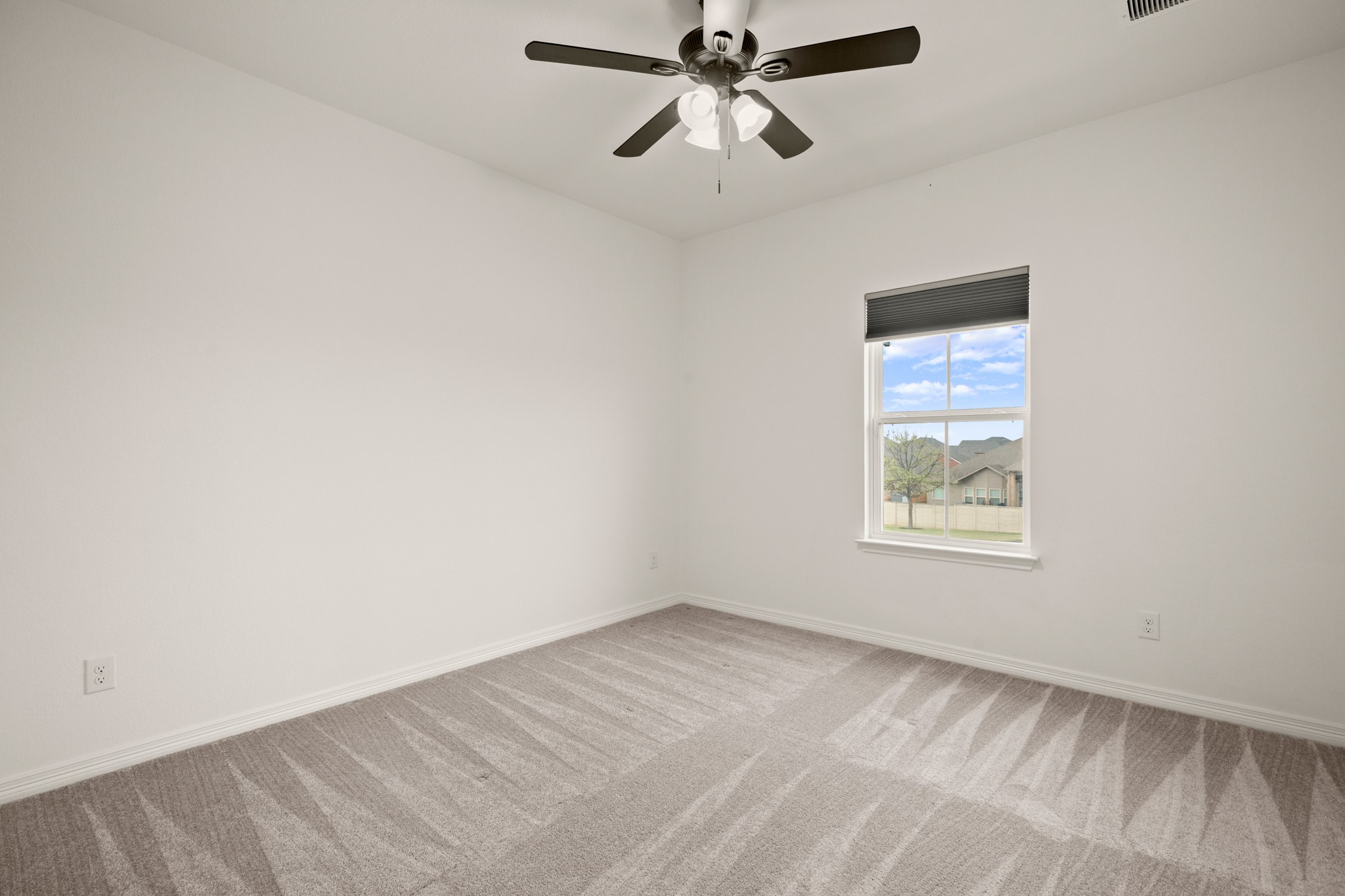 20521 Martin Lane Pflugerville, TX 78660 - Photo 23 of 40 One of three secondary bedrooms upstairs, all with ceiling fans, closet storage, and cozy carpeting.
