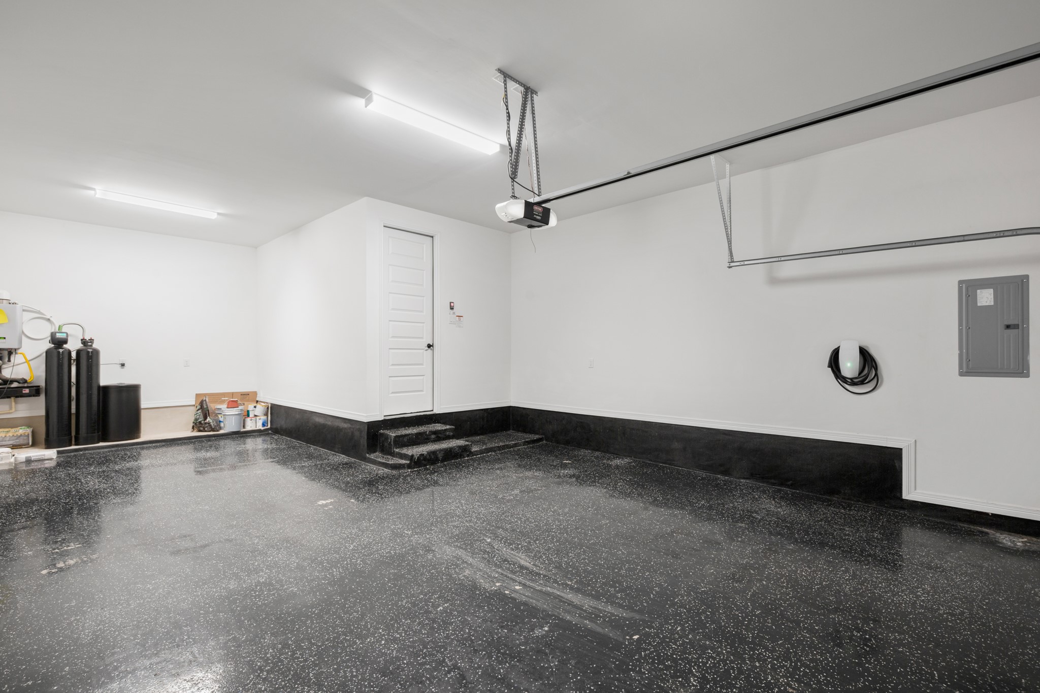 20521 Martin Lane Pflugerville, TX 78660 - Photo 28 of 40 Storage galore both inside and in the oversized 3-car garage with tandem parking plus there's a water softener with carbon backwash filter.