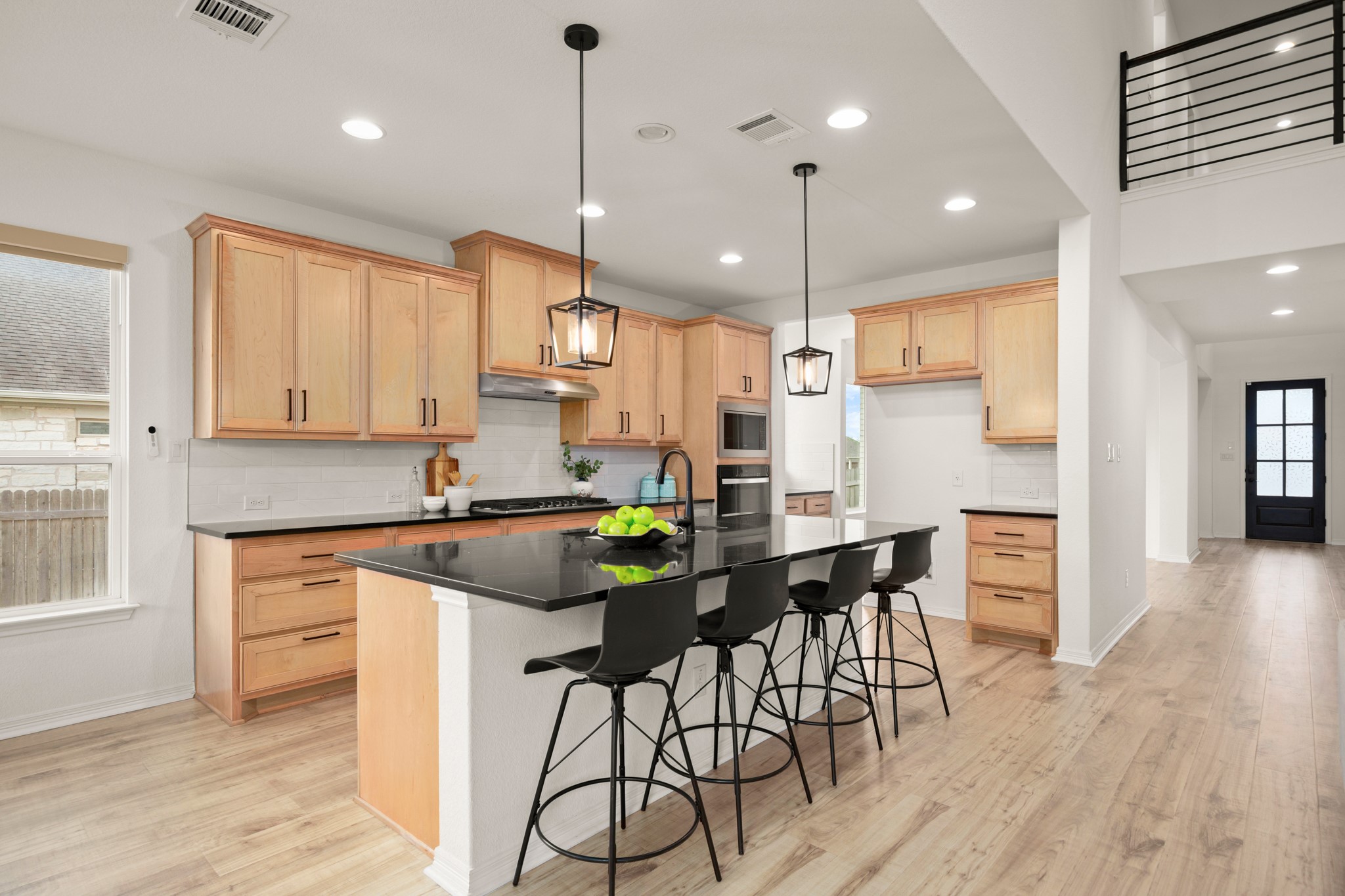 20521 Martin Lane Pflugerville, TX 78660 - Photo 6 of 40 The kitchen is a contemporary dream with all the desirable modern finishes and a spacious sunny dining area.