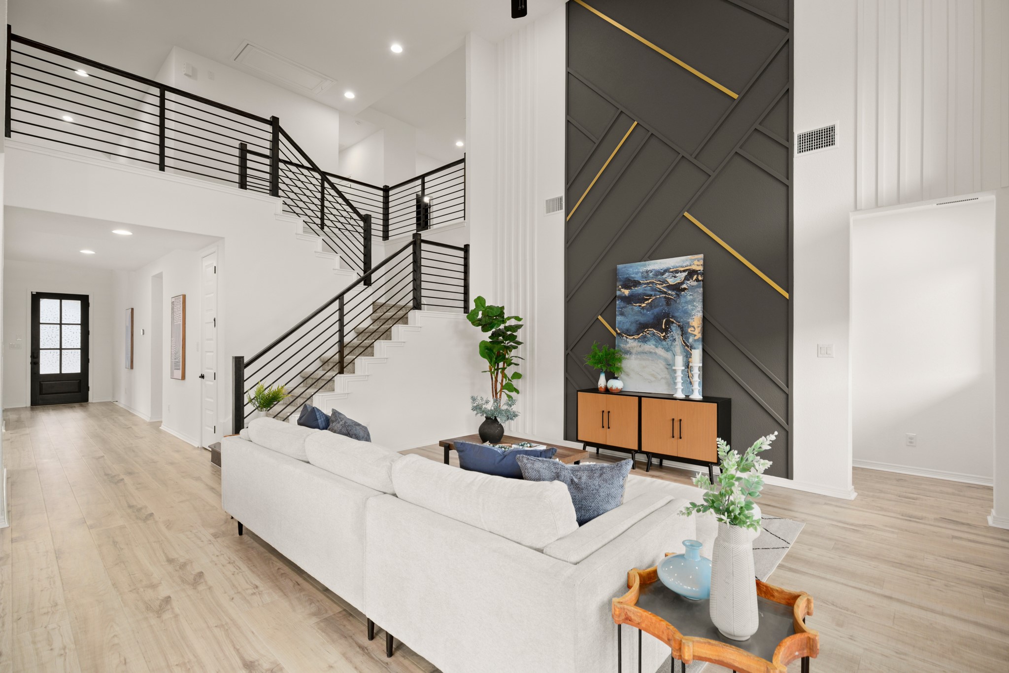 20521 Martin Lane Pflugerville, TX 78660 - Photo 40 of 40 A wide entry foyer flows past the home office and formal dining room into the gorgeous sunlit open floor plan living area.