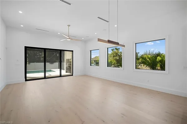 a kitchen with kitchen island a counter top space stainless steel appliances and cabinets