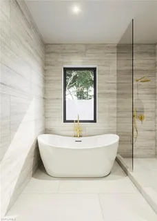 a white bath tub sitting in a bathroom