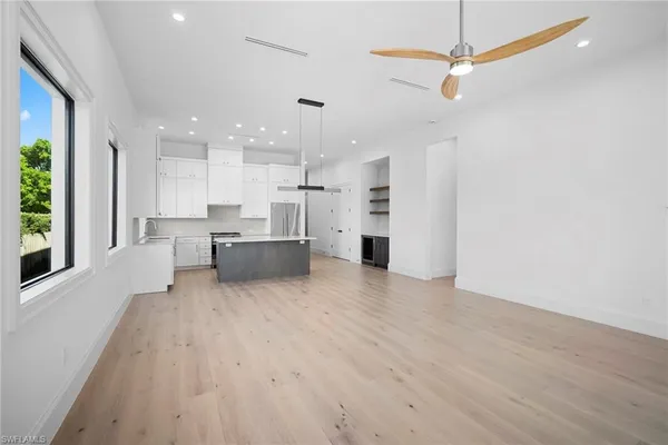 a view of kitchen and window with furniture