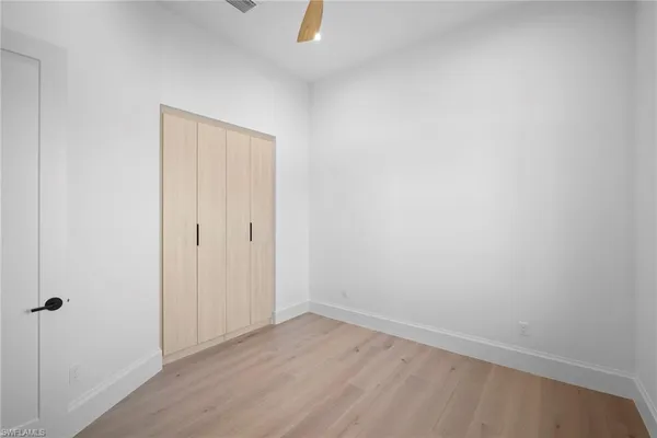 a bathroom with a sink vanity and a toilet