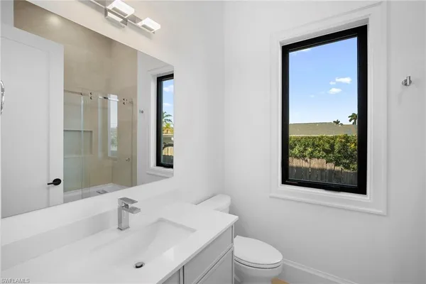 a white bath tub sitting next to a window