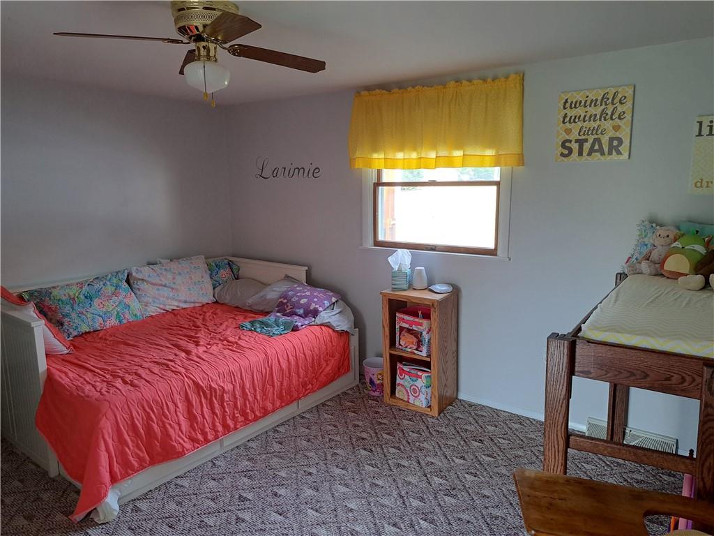 5146 McCandless Road Butler, PA 16001 - Photo 15 of 24 a bedroom with a bed and a dresser in it