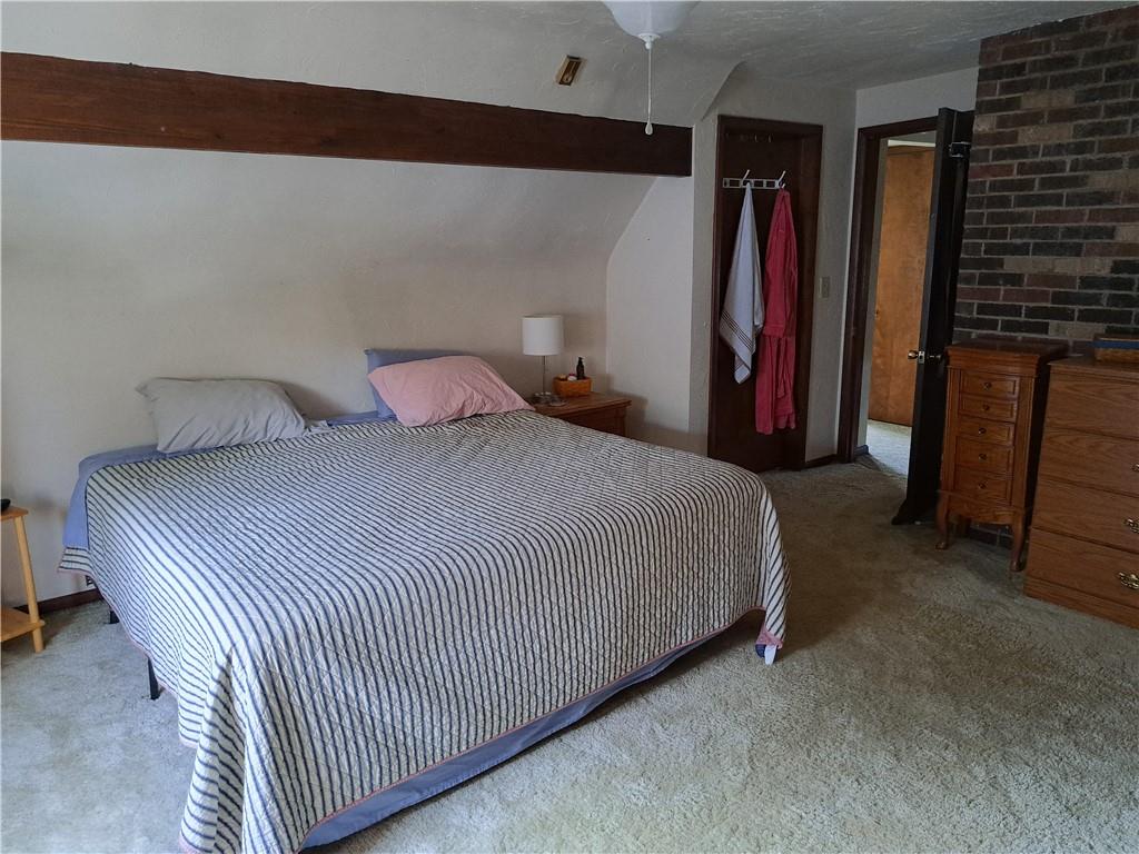 5146 McCandless Road Butler, PA 16001 - Photo 17 of 24 a bed room with a bed and a walk in closet