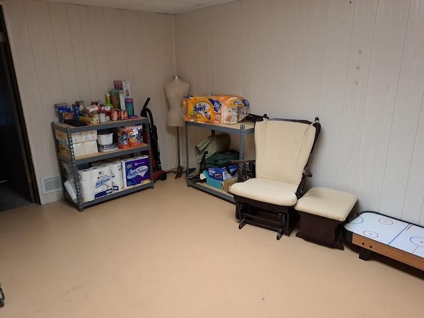 5146 McCandless Road Butler, PA 16001 - Photo 23 of 24 a living room with furniture and a shelf