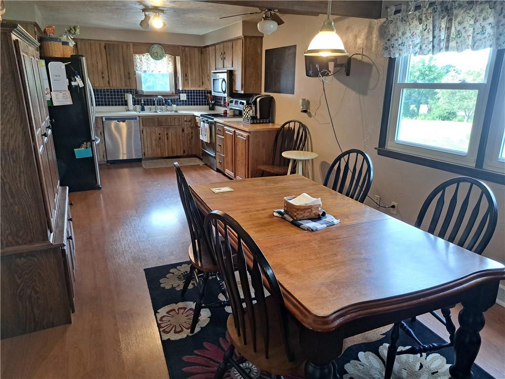 5146 McCandless Road Butler, PA 16001 - Photo 7 of 24 a view of a dining room with furniture window and wooden floor