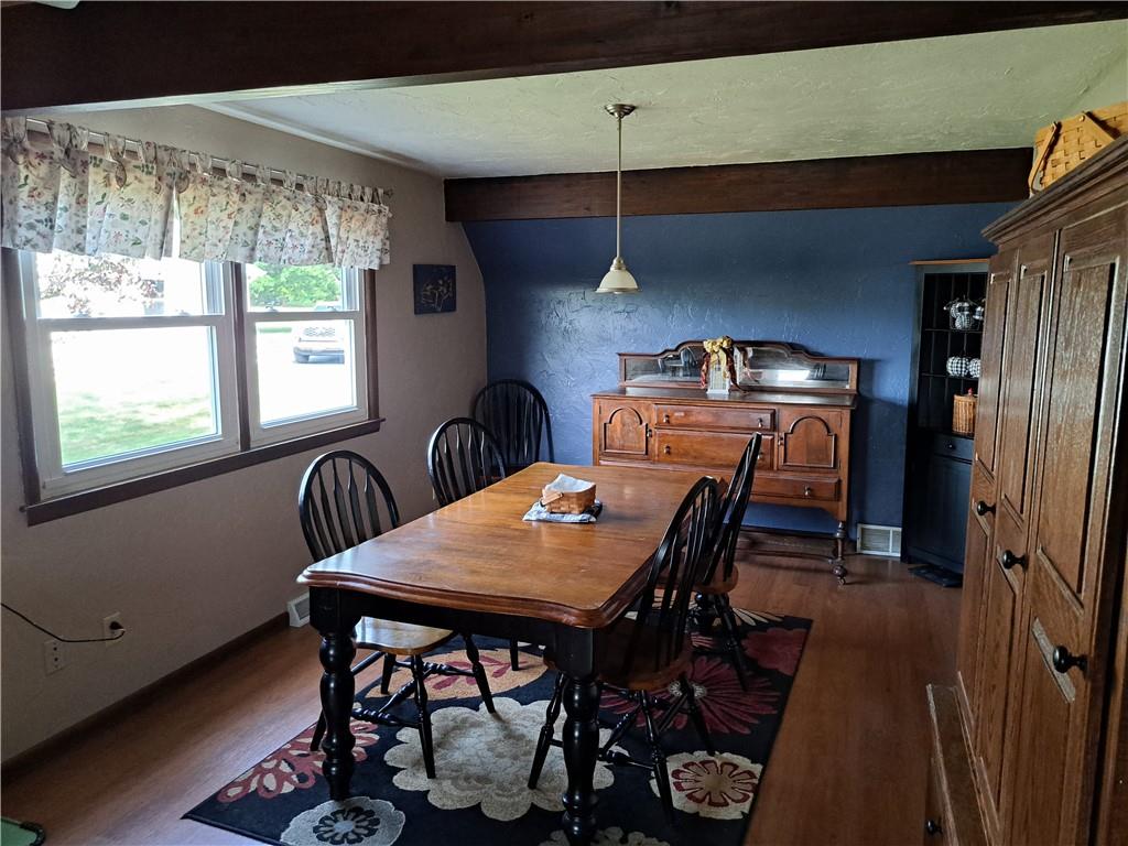 5146 McCandless Road Butler, PA 16001 - Photo 9 of 24 a view of a dining room with furniture window and wooden floor