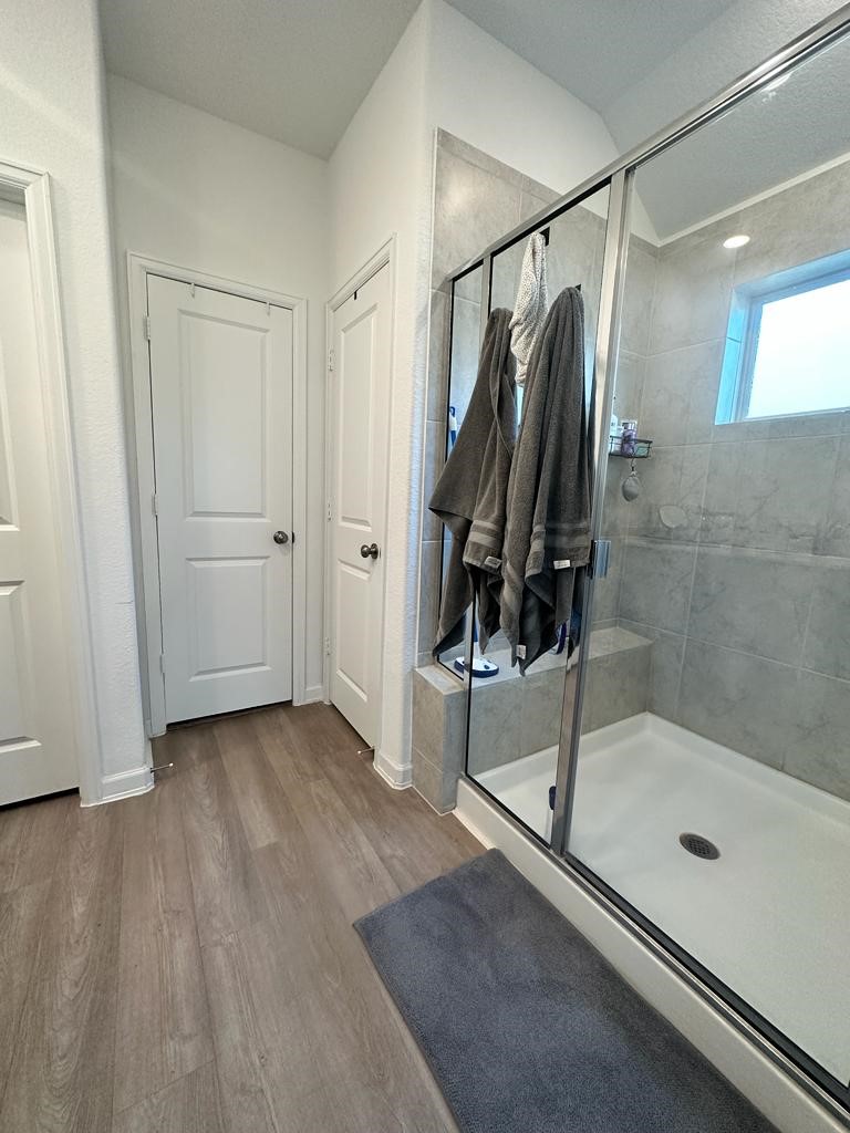 25406 Rustic Sq Trace Katy, TX 77493 - Photo 10 of 14 a bathroom with a shower and a glass door