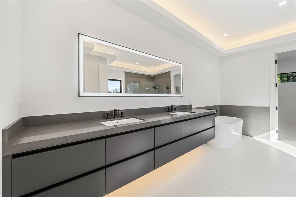 18851 42nd Road North Loxahatchee, FL 33470 - Photo 12 of 22 a hall with a sink and a mirror