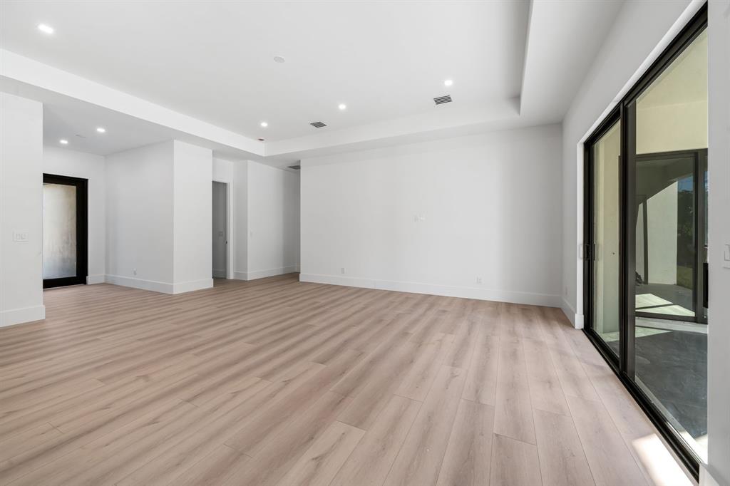 18851 42nd Road North Loxahatchee, FL 33470 - Photo 5 of 22 a view of an empty room with wooden floor and a window