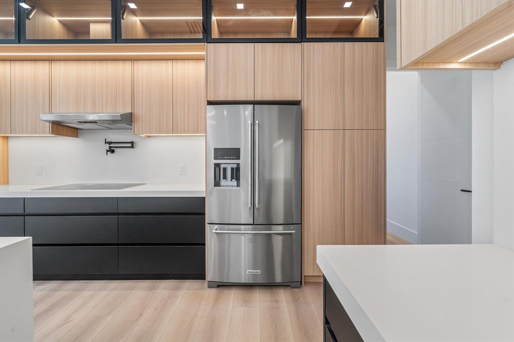 18851 42nd Road North Loxahatchee, FL 33470 - Photo 10 of 22 a kitchen with kitchen island a counter top space wooden floor and appliances