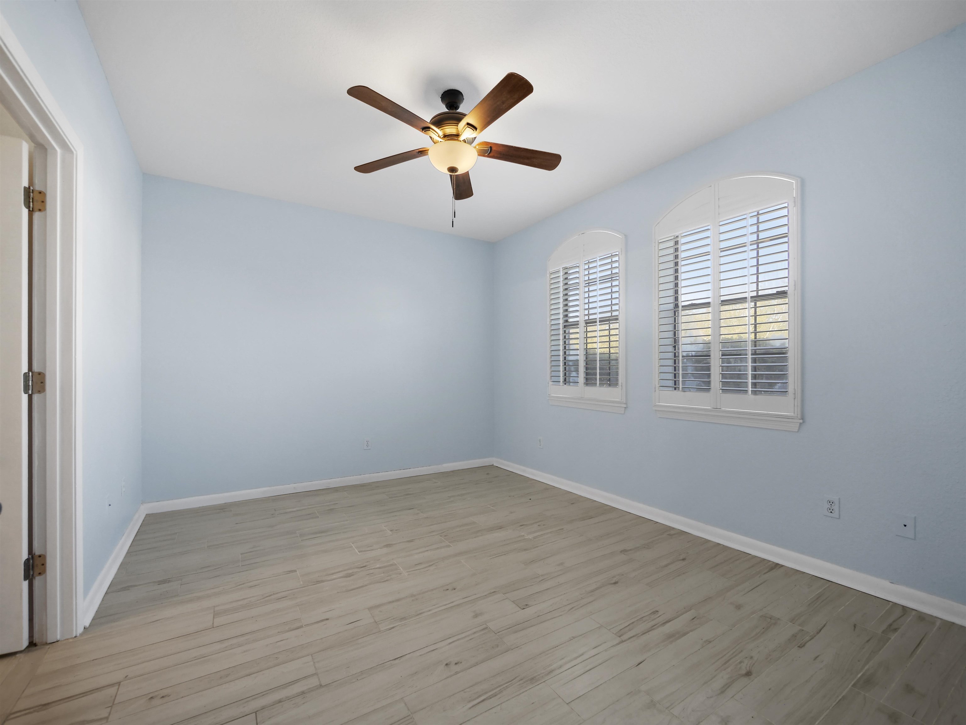 2200 Vista Cove Road St. Augustine, FL 32084 - Photo 14 of 44 a view of empty room with wooden floor and fan