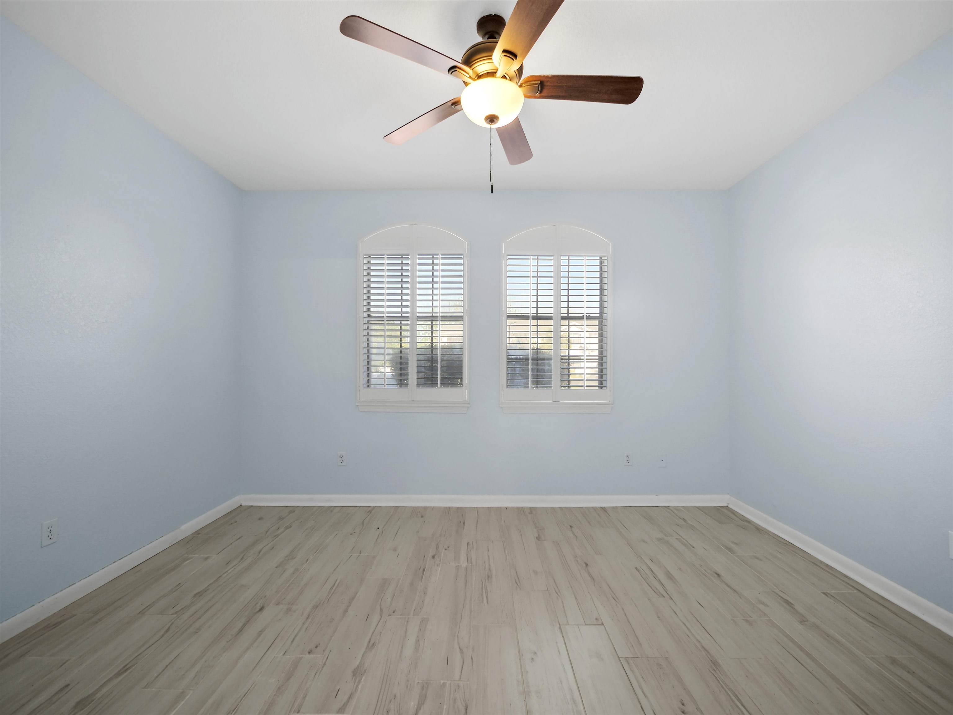 2200 Vista Cove Road St. Augustine, FL 32084 - Photo 15 of 44 wooden floor in an empty room with a window