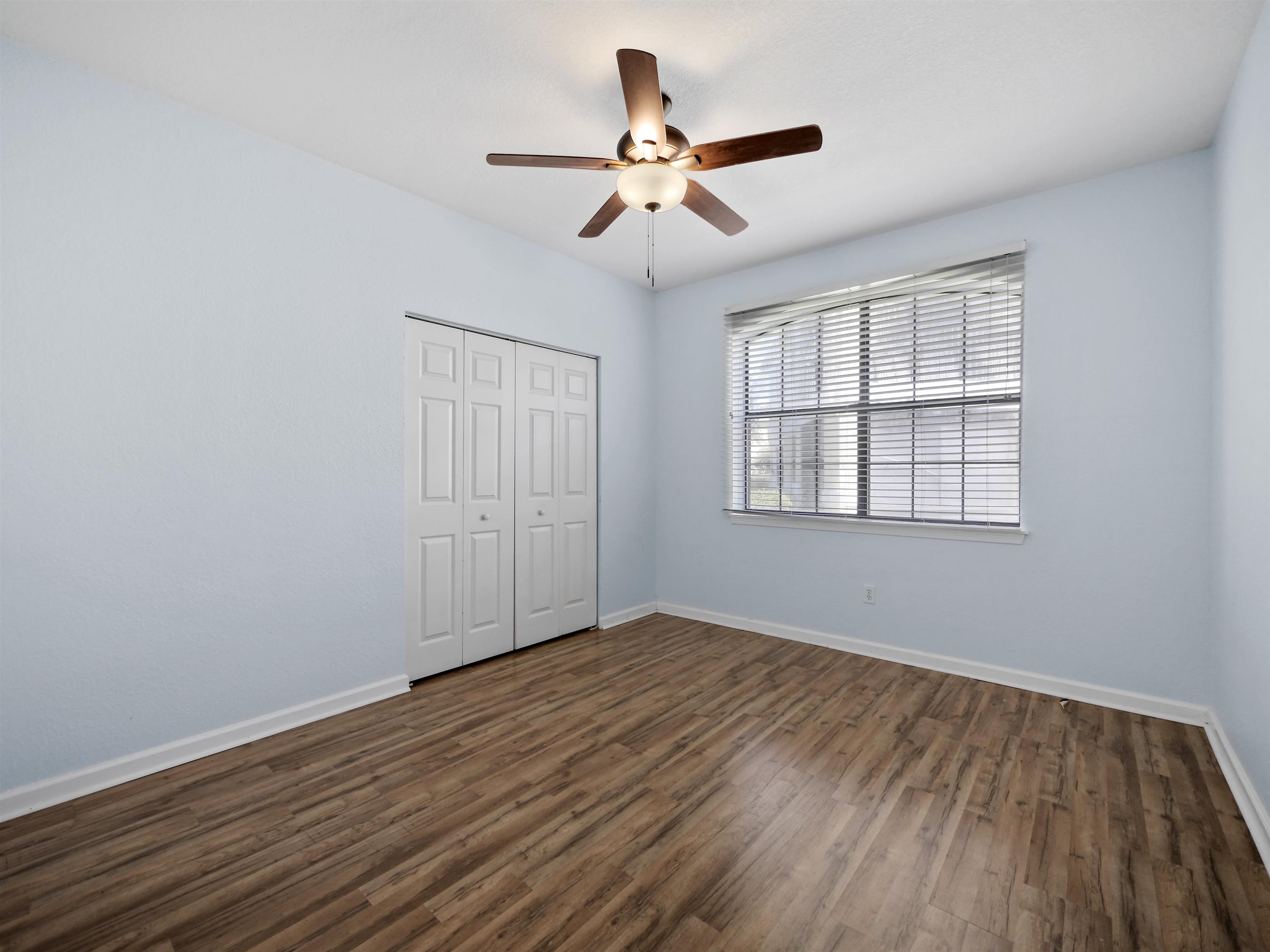 2200 Vista Cove Road St. Augustine, FL 32084 - Photo 20 of 44 wooden floor in an empty room with a window
