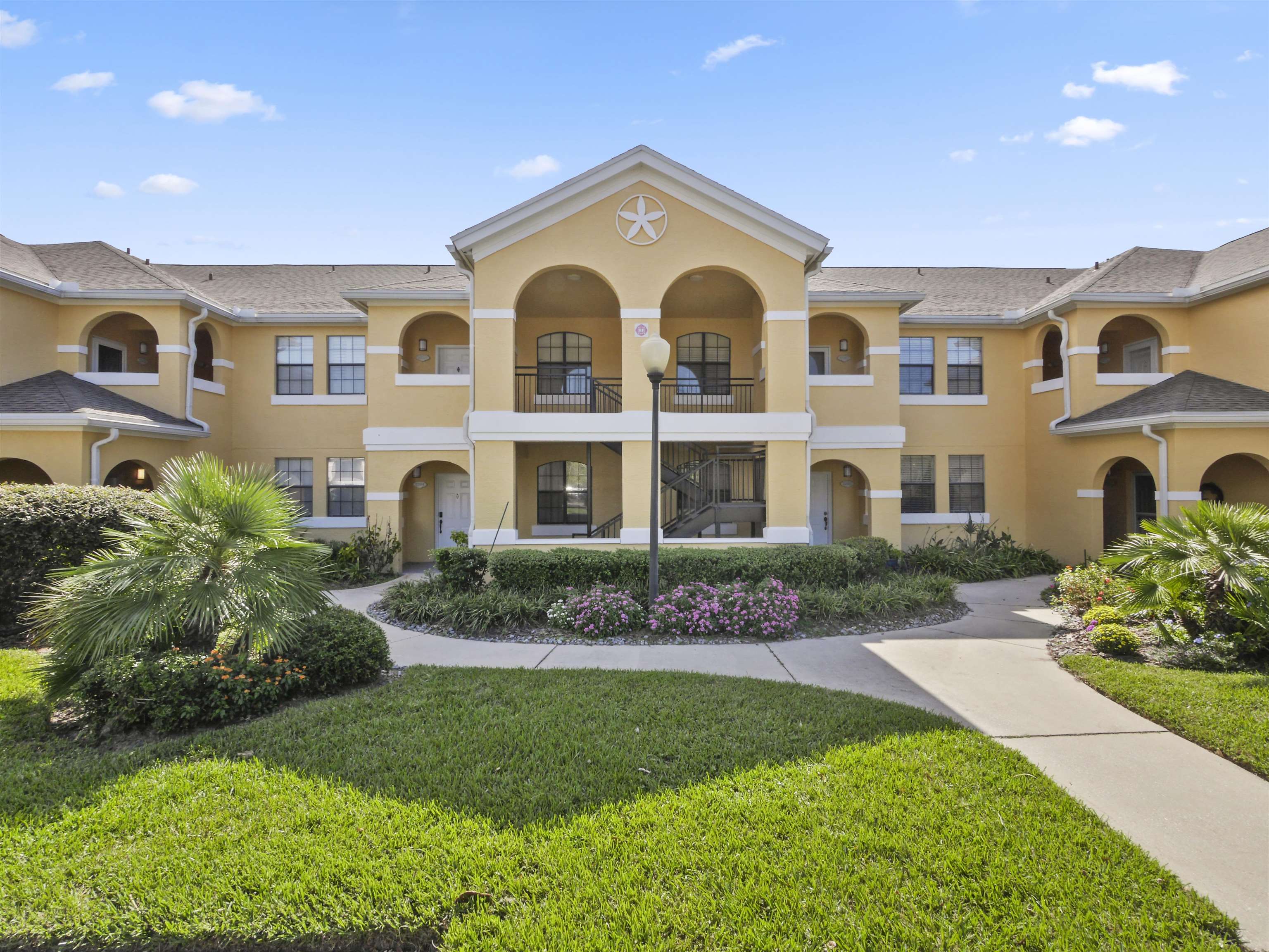 2200 Vista Cove Road St. Augustine, FL 32084 - Photo 2 of 44 a front view of a house with a garden