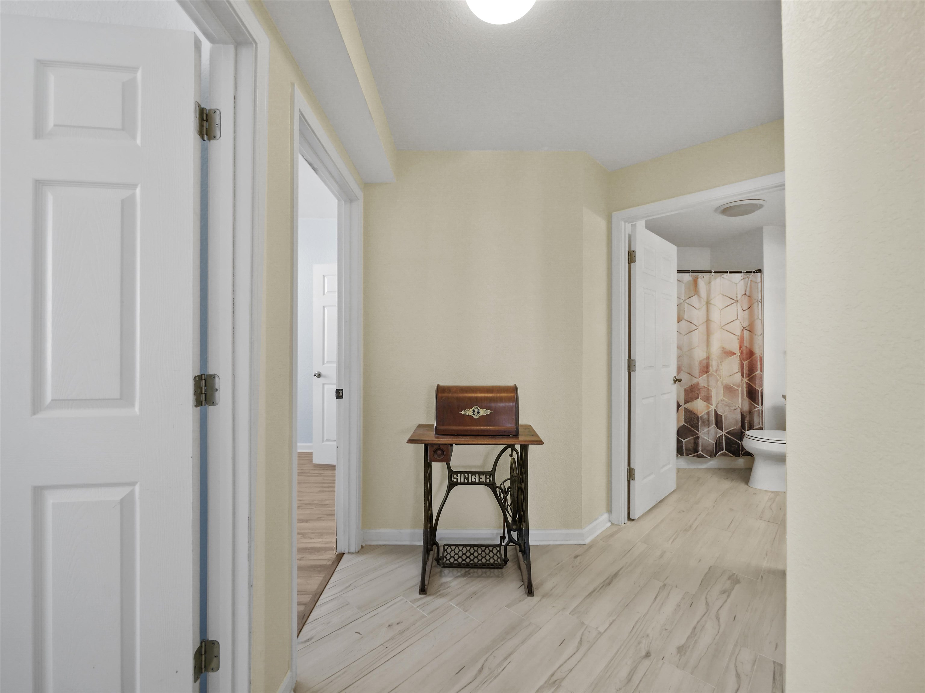 2200 Vista Cove Road St. Augustine, FL 32084 - Photo 22 of 44 a view of a hallway with wooden floor and a workspace