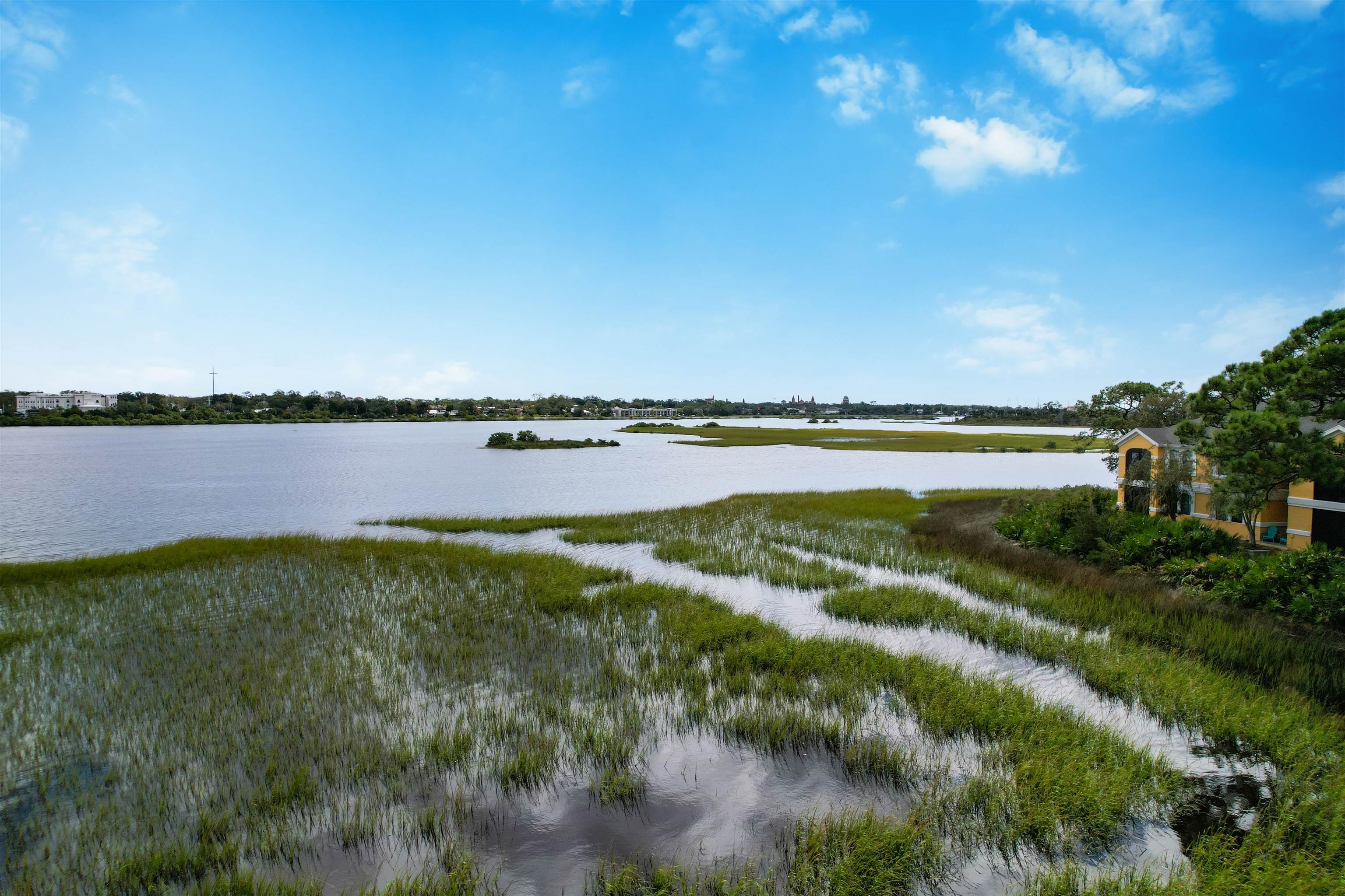 2200 Vista Cove Road St. Augustine, FL 32084 - Photo 30 of 44 a view of a lake with houses in the background