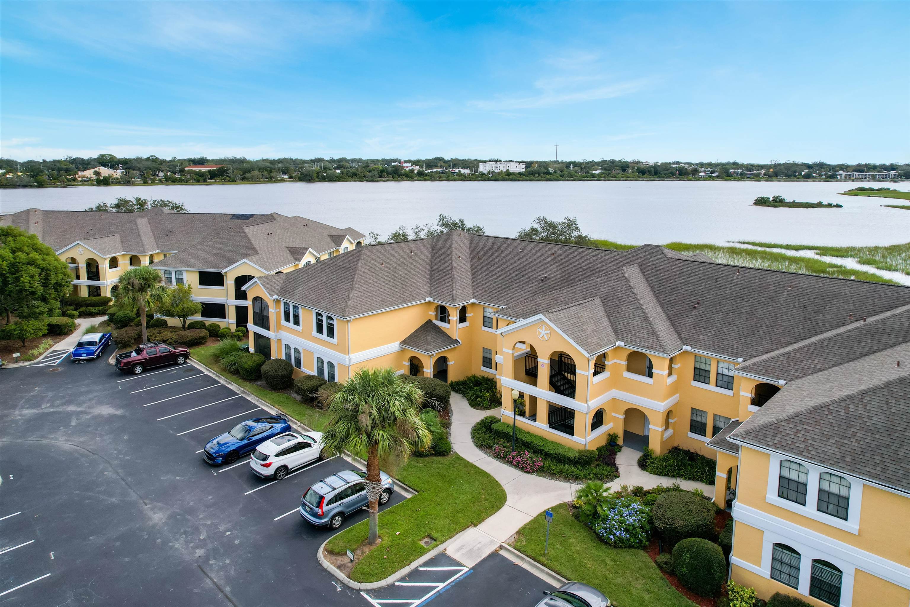 2200 Vista Cove Road St. Augustine, FL 32084 - Photo 31 of 44 a view of a lake with a building in front of it