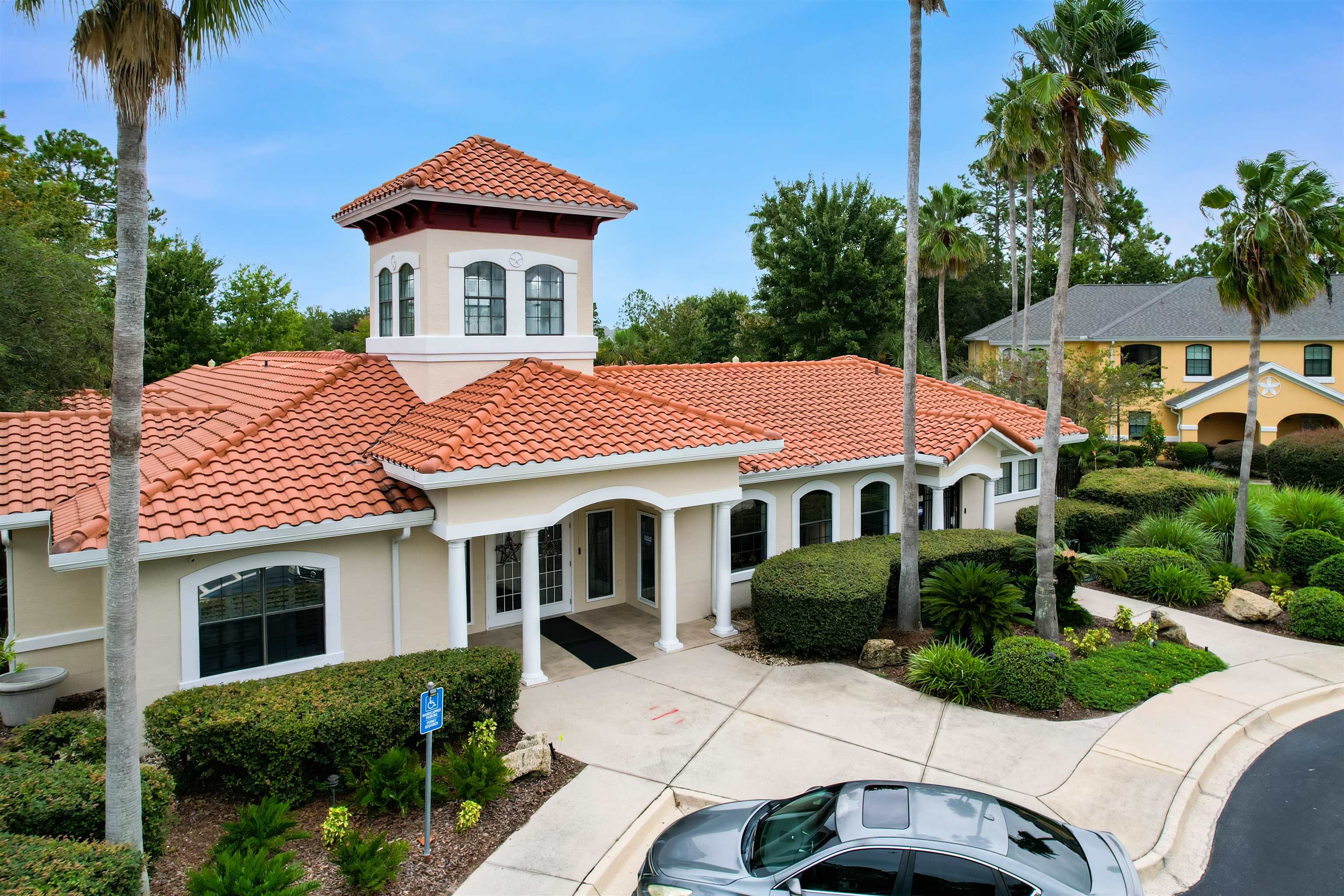2200 Vista Cove Road St. Augustine, FL 32084 - Photo 35 of 44 a front view of a house with a yard and potted plants