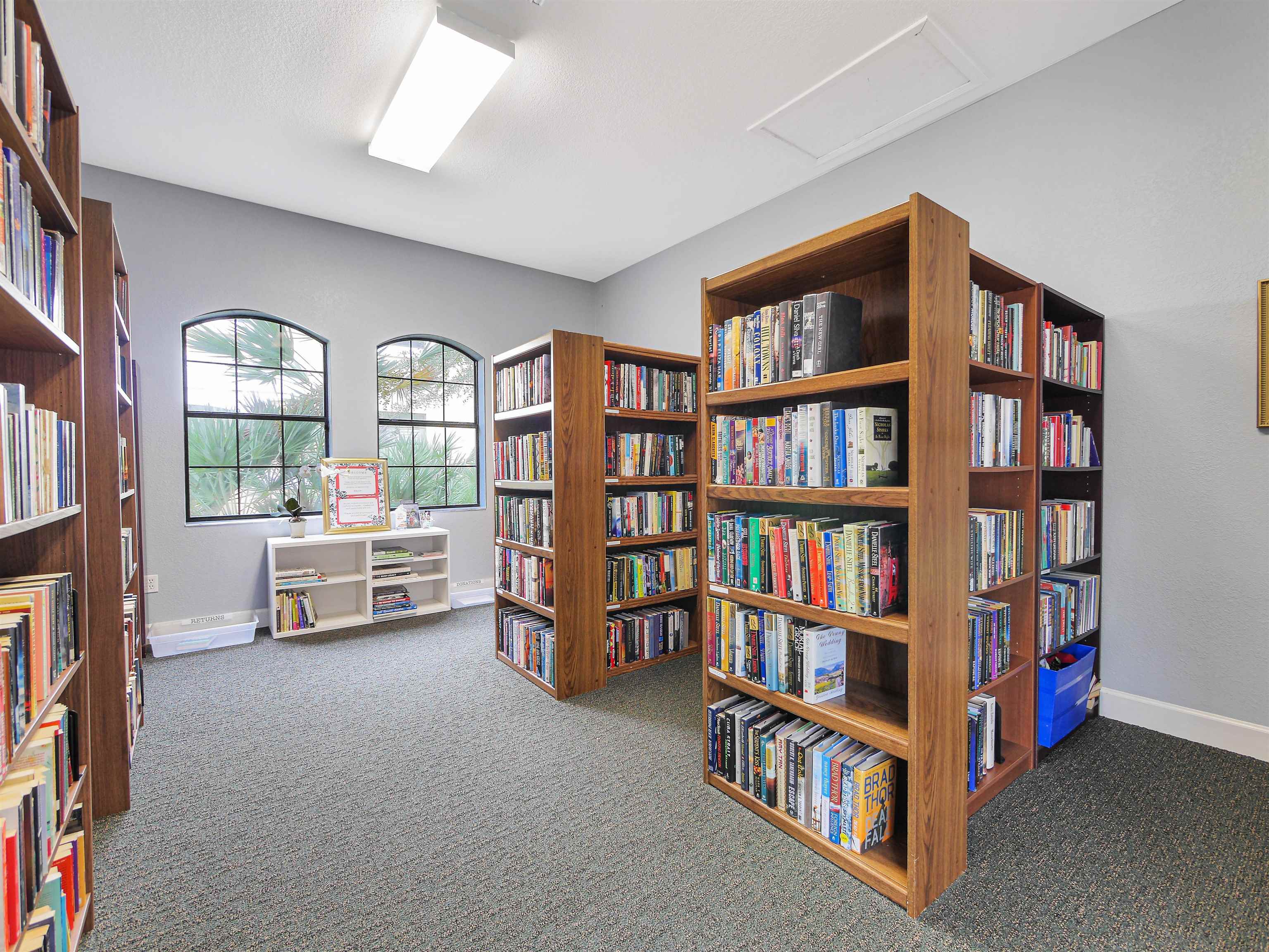2200 Vista Cove Road St. Augustine, FL 32084 - Photo 37 of 44 a room with furniture and a book shelf