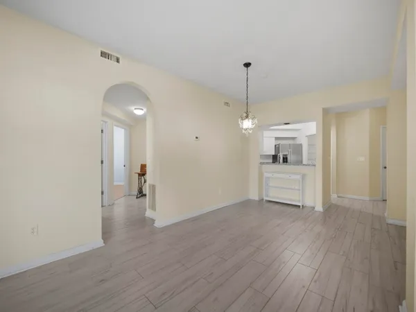 a view of a kitchen cabinets and wooden floor