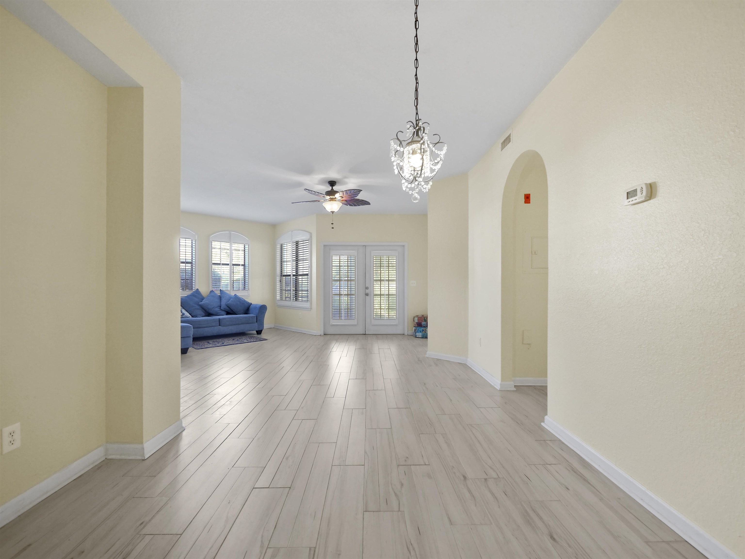 2200 Vista Cove Road St. Augustine, FL 32084 - Photo 9 of 44 a view of a livingroom with furniture wooden floor and chandelier