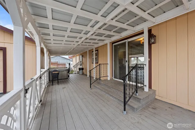 a view of a room with wooden floor