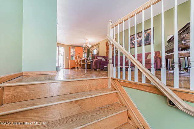 a view of swimming pool with dining room and stairs
