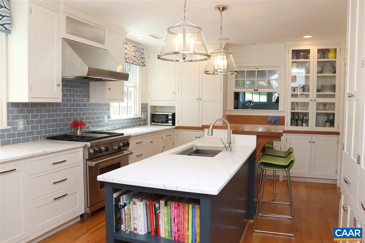 16 Canterbury Road Charlottesville, VA 22903 - Photo 13 of 37 a kitchen with a table chairs and cabinets