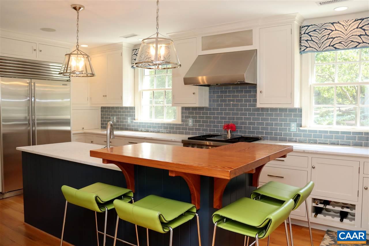 16 Canterbury Road Charlottesville, VA 22903 - Photo 14 of 37 a kitchen with a dining table chairs and a sink