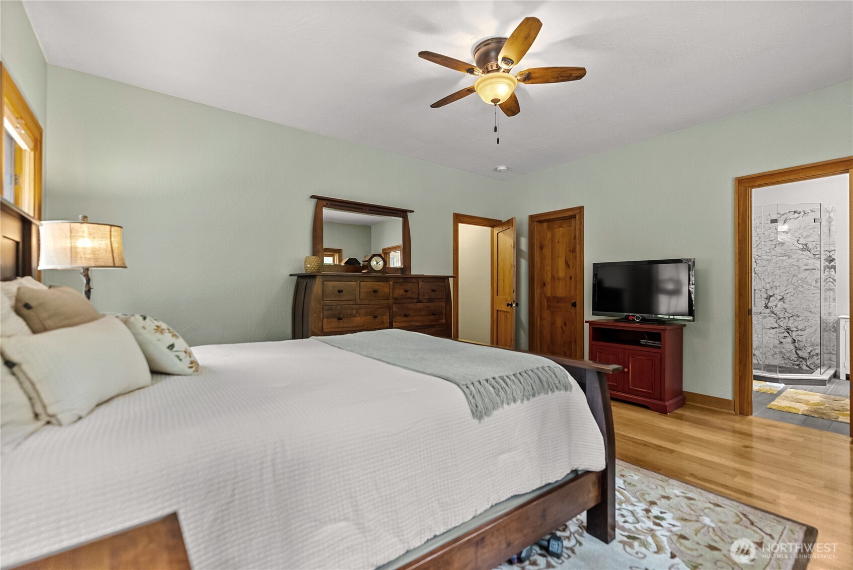 201 Libby Creek Road Carlton, WA 98814 - Photo 17 of 37 a bedroom with a bed and a flat screen tv