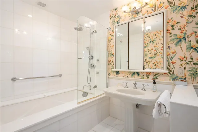 a bathroom with a bathtub and a sink