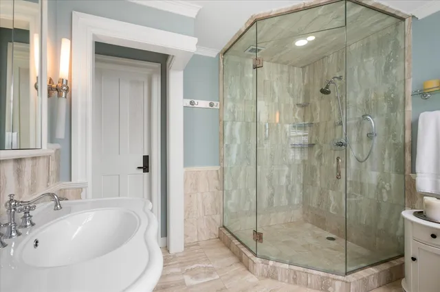 a bathroom with a shower and a sink