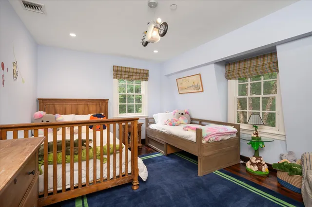 a bedroom with bed and a window