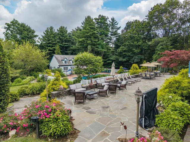 an outdoor space with seating area and garden