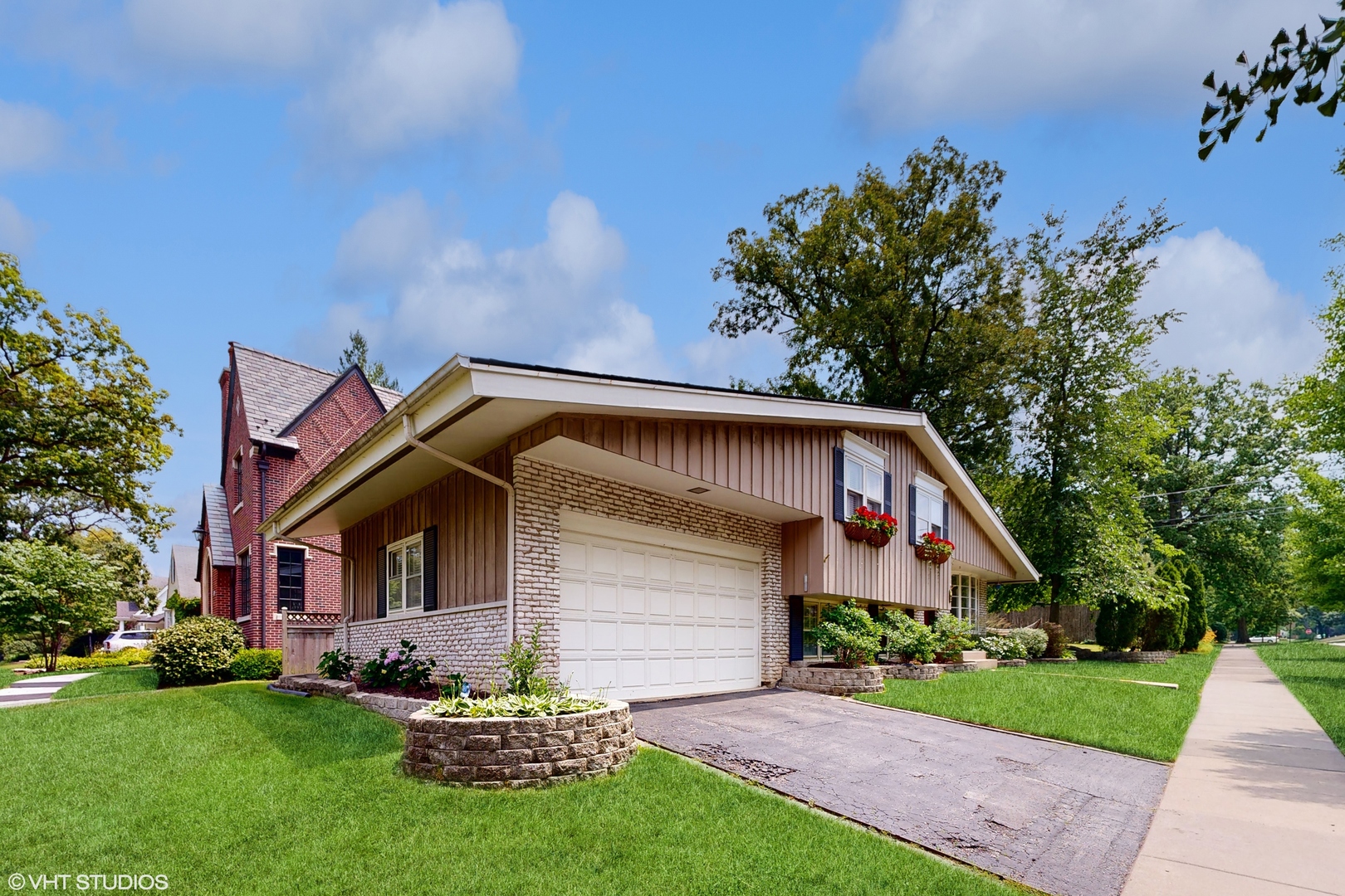 15 Winston Road Lake Forest, IL 60045 - Photo 3 of 26 a front view of a house with a garden and plants